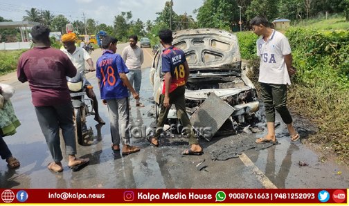 Car bursts into flames in the middle of the road