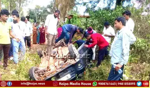 Shivamogga snake on NH Road Car Overturns Into Drain copy